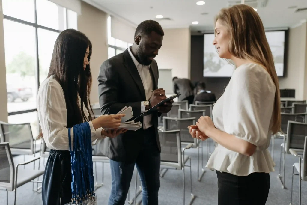 Professionals building connections at a social networking event in Singapore.